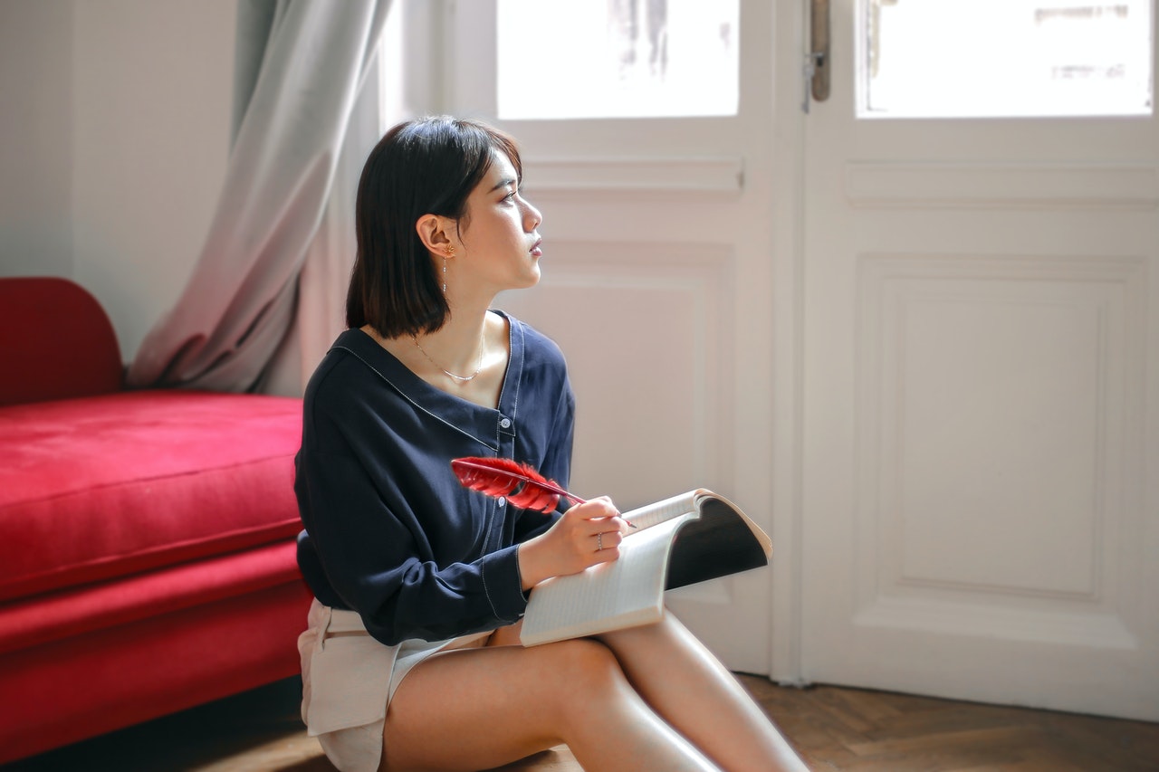 a pensive teenager in her bedroom 