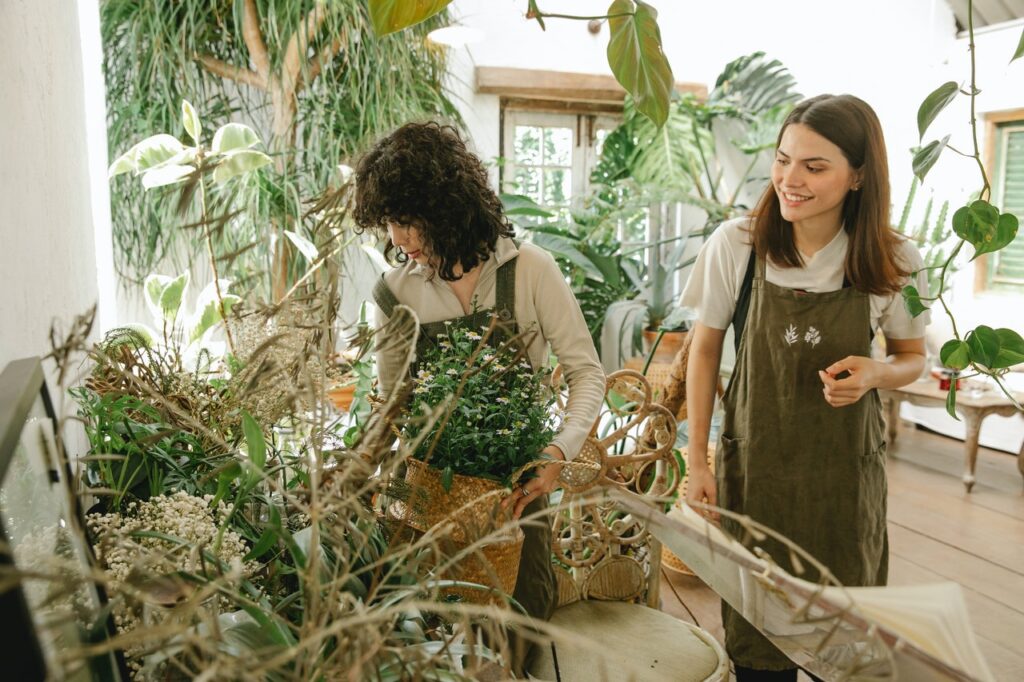 Cheerful florists in floral shop