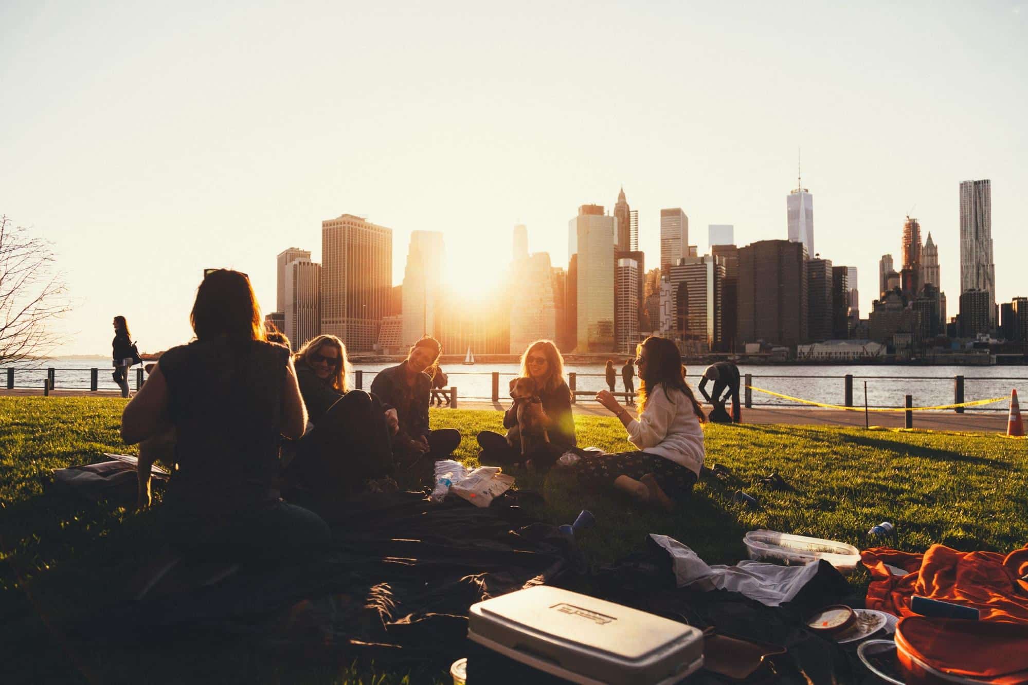 Alt Text: college students studying in city park