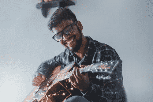 Young man playing guitar 