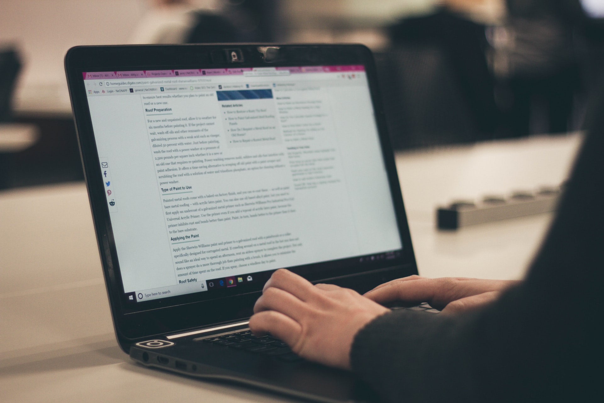 teen typing on a laptop 