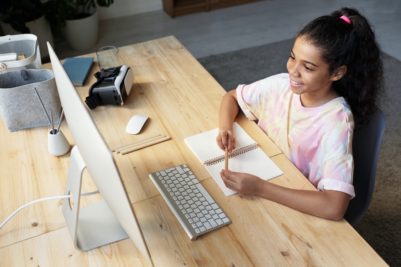 Young girl taking a online math course 