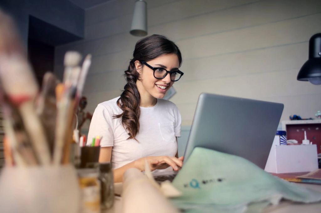 a woman working off a laptop 