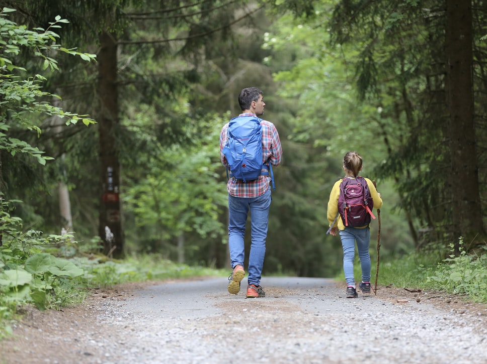 kids hiking with their mother 