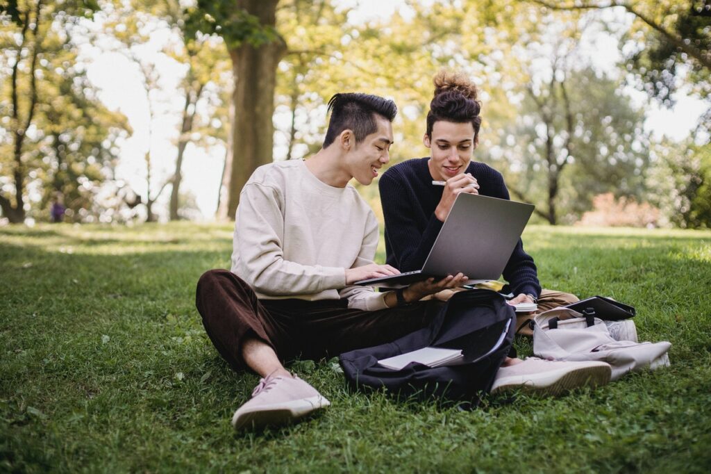 two students studying on campus